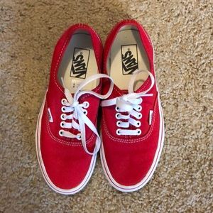 Red low top Vans.